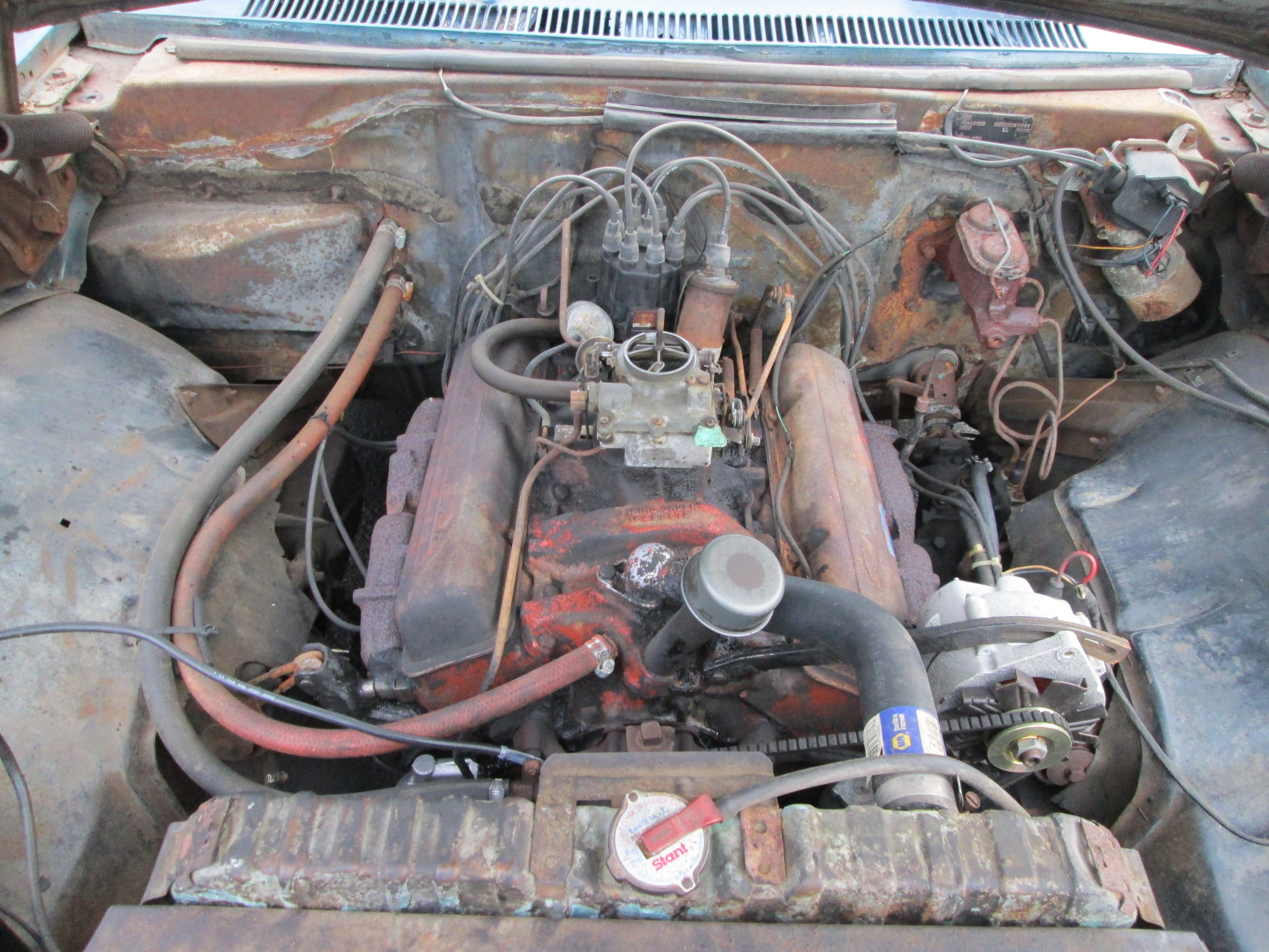 Engine after the degreaser treatment, getting it's orange paint back!